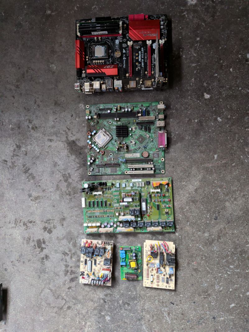 Computer motherboards and PCBs of various sizes arranged for recycling